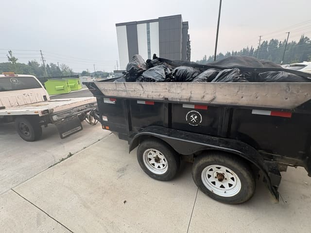 dump trailer full of garbage ready to be moved