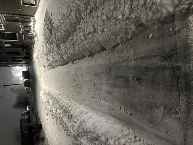 A commercial parking lot cleared of snow
